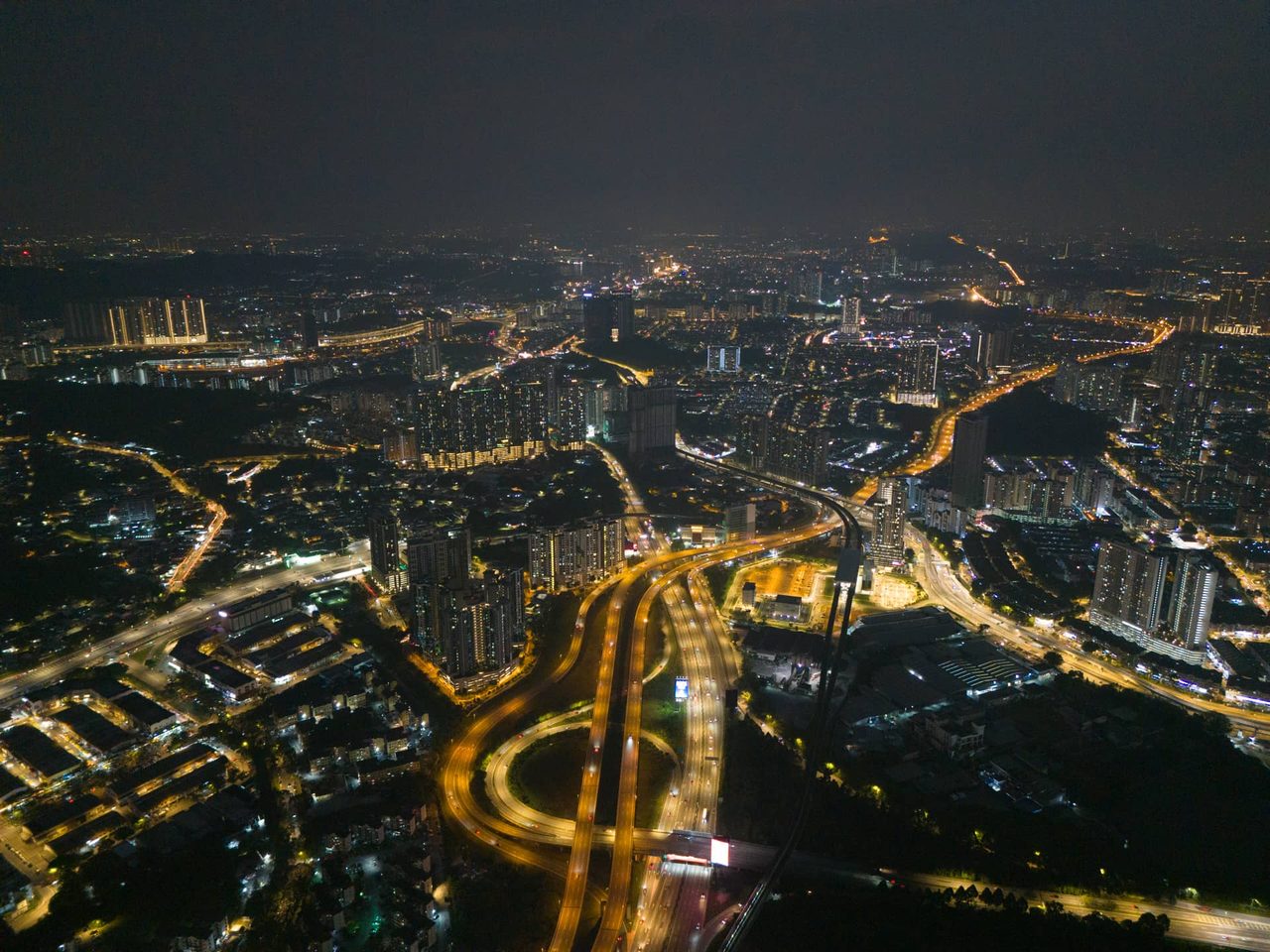 Aerial night view over Taman Desa and the Kuala Lumpur city corridor